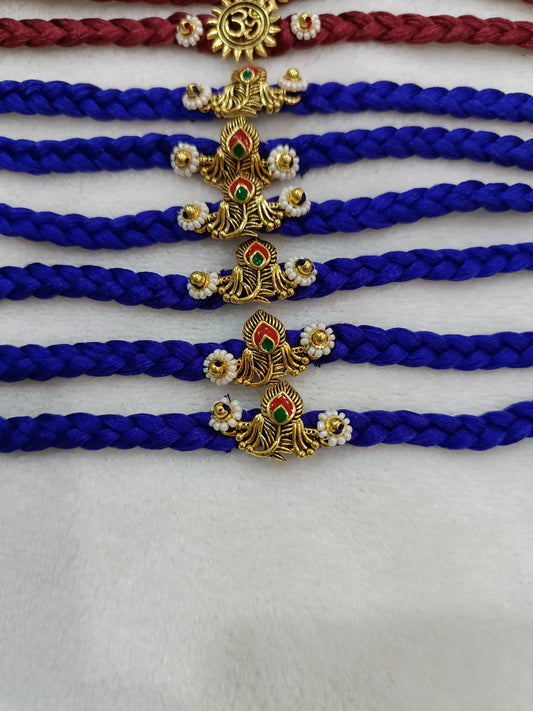 BRAIDED RAKHI WITH DEVOTIONAL CHARMS